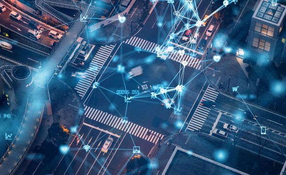 Eine Straßenkreuzung von oben mit vielen virtuellen Verbindungslinien zwischen Häusern und Autos.